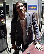 Corporate zombie pumping gas